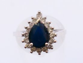 A platinum, sapphire and diamond ring. Ring size O.