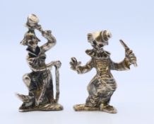 Two clown figures. The largest 6.5 cm high.
