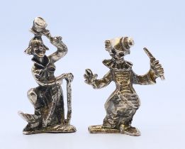 Two clown figures. The largest 6.5 cm high.