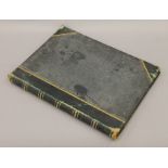 A Victorian photograph album of Paris. 33 cm wide.