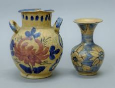 Two antique Persian pottery vases. The largest 19 cm high.