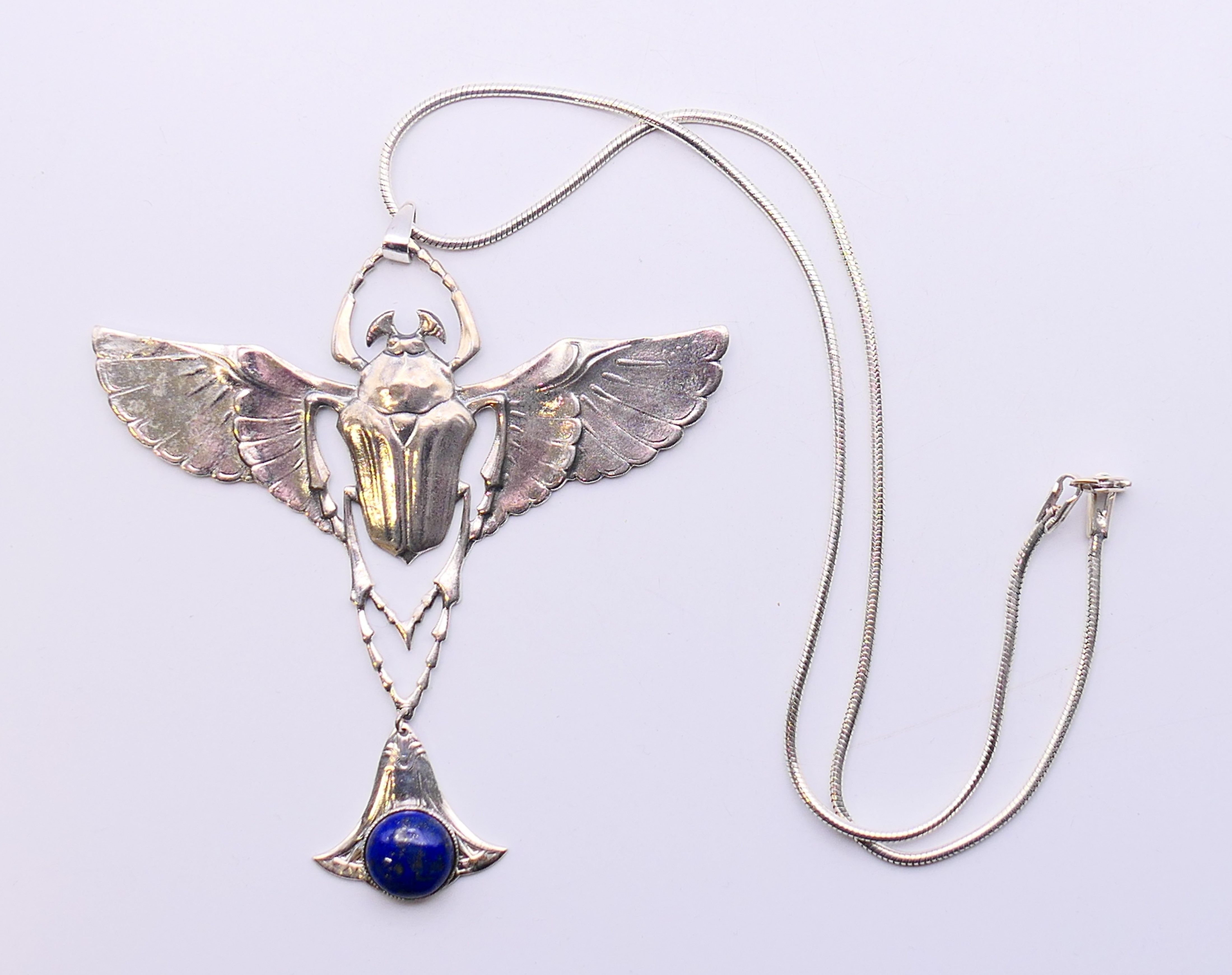 A silver and lapiz scarab pendant necklace. Pendant 9 cm high, chain 45 cm long. - Image 2 of 8