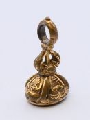 A fob seal set with a carved heraldic seal. 2 cm high.