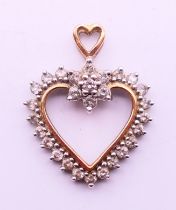 A 9 ct gold heart pendant. 3 cm high.