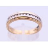 A 9 ct yellow and white gold diamond ring. Ring size P.