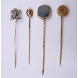 Three gold stick pins and another formed as a frog. Frog stick pin 6.5 cm high (frog 1.5 cm high).