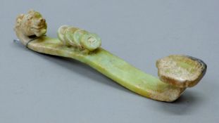 A jade ruyi sceptre. 20 cm high.