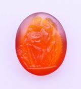 An antique carnelian intaglio carved with a naked man and lady in a landscape and with script. 1.