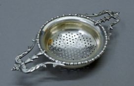 A silver tea strainer. 14 cm wide. 57.2 grammes.