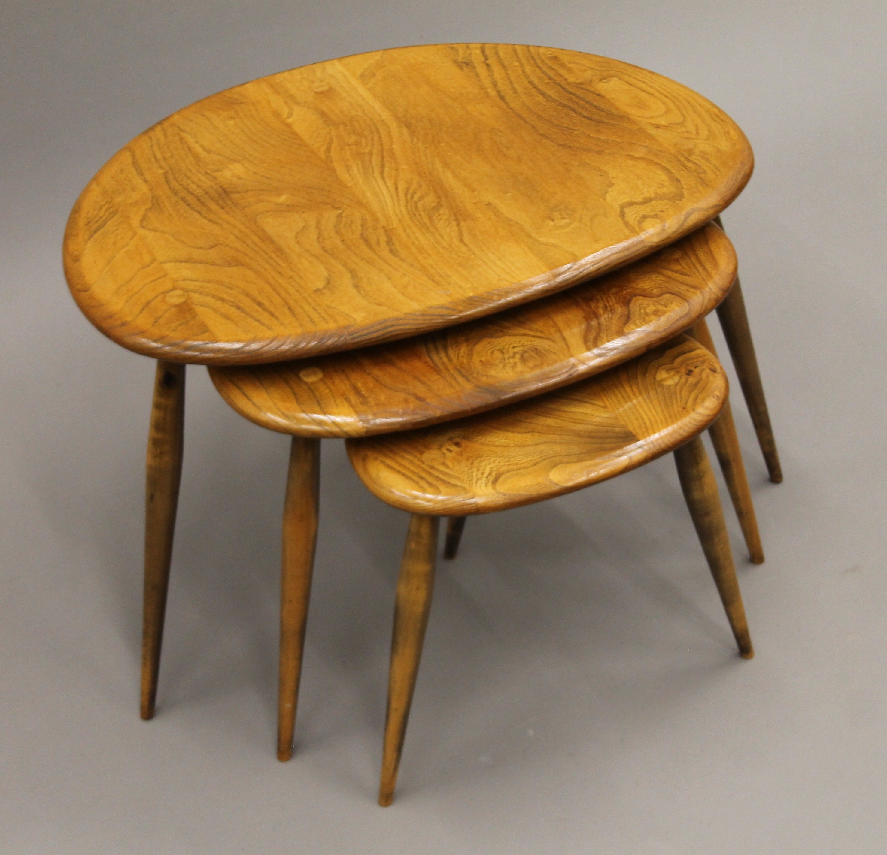 A nest of three Ercol pebble coffee tables. 46 cm wide. - Image 3 of 5