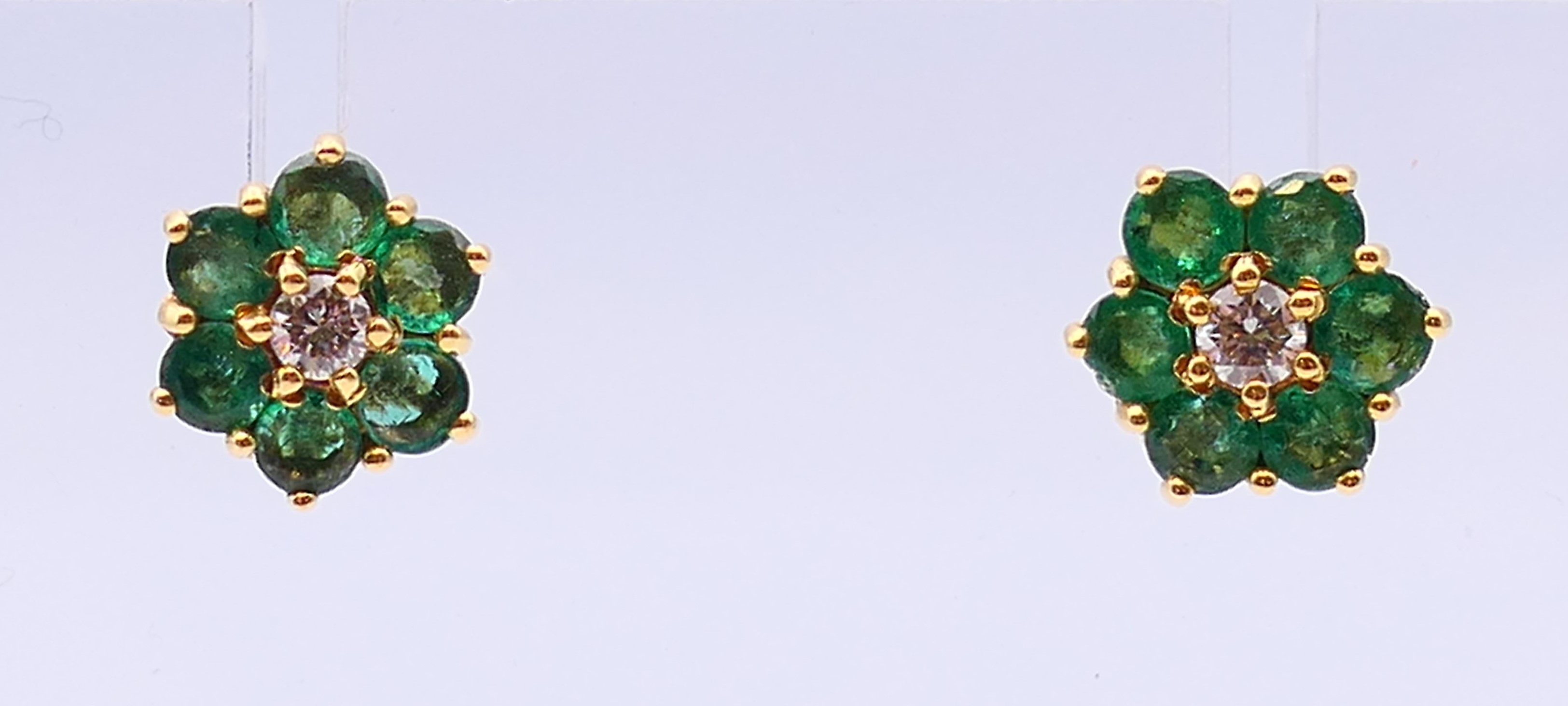 A pair of 18 ct gold, emerald and diamond cluster earrings,