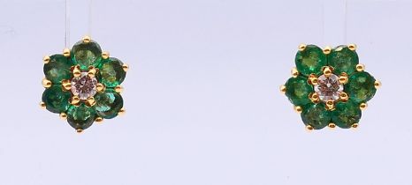 A pair of 18 ct gold, emerald and diamond cluster earrings,