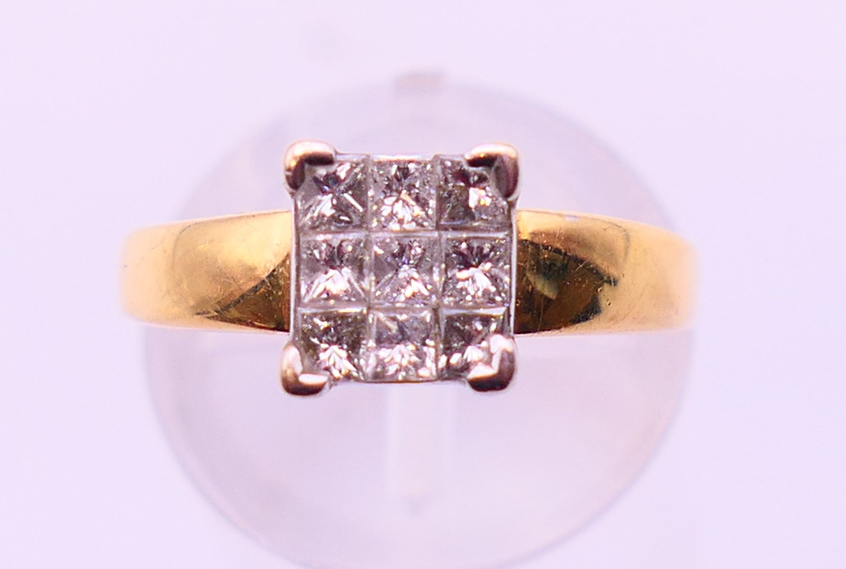 An 18 ct gold ring set with nine diamonds. together with a copy of a 2012 insurance valuation. - Image 2 of 8