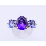 A 14 ct white gold, amethyst and topaz ring. 4.9 grammes. Ring size Q/R.