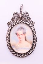 A 19th century portrait miniature on ivory of a lady a diamond set frame with bow tied swag and