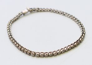A diamond line bracelet. 18.5 cm long.