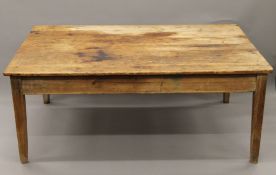 A large Victorian pine kitchen table (lacking drawers). 181 cm long x 120 cm wide.