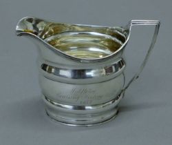 A Georgian silver jug, inscribed Middleton Coursing Meeting Oct 1837 Master of Arts. 9.5 cm high.