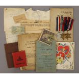 Three WWII medals and a quantity of ephemera to include a Soldier's Service and Pay Book,