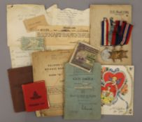Three WWII medals and a quantity of ephemera to include a Soldier's Service and Pay Book,