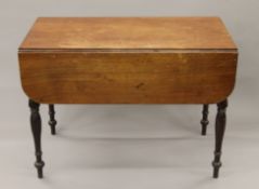 A 19th century mahogany Pembroke table. 58 cm wide flaps down.
