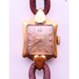 An 18 ct gold Certina ladies wristwatch. 1.5 cm wide.