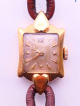 An 18 ct gold Certina ladies wristwatch. 1.5 cm wide.