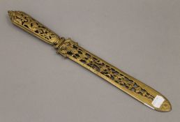 A Victorian ornate brass page turner. 39 cm long.