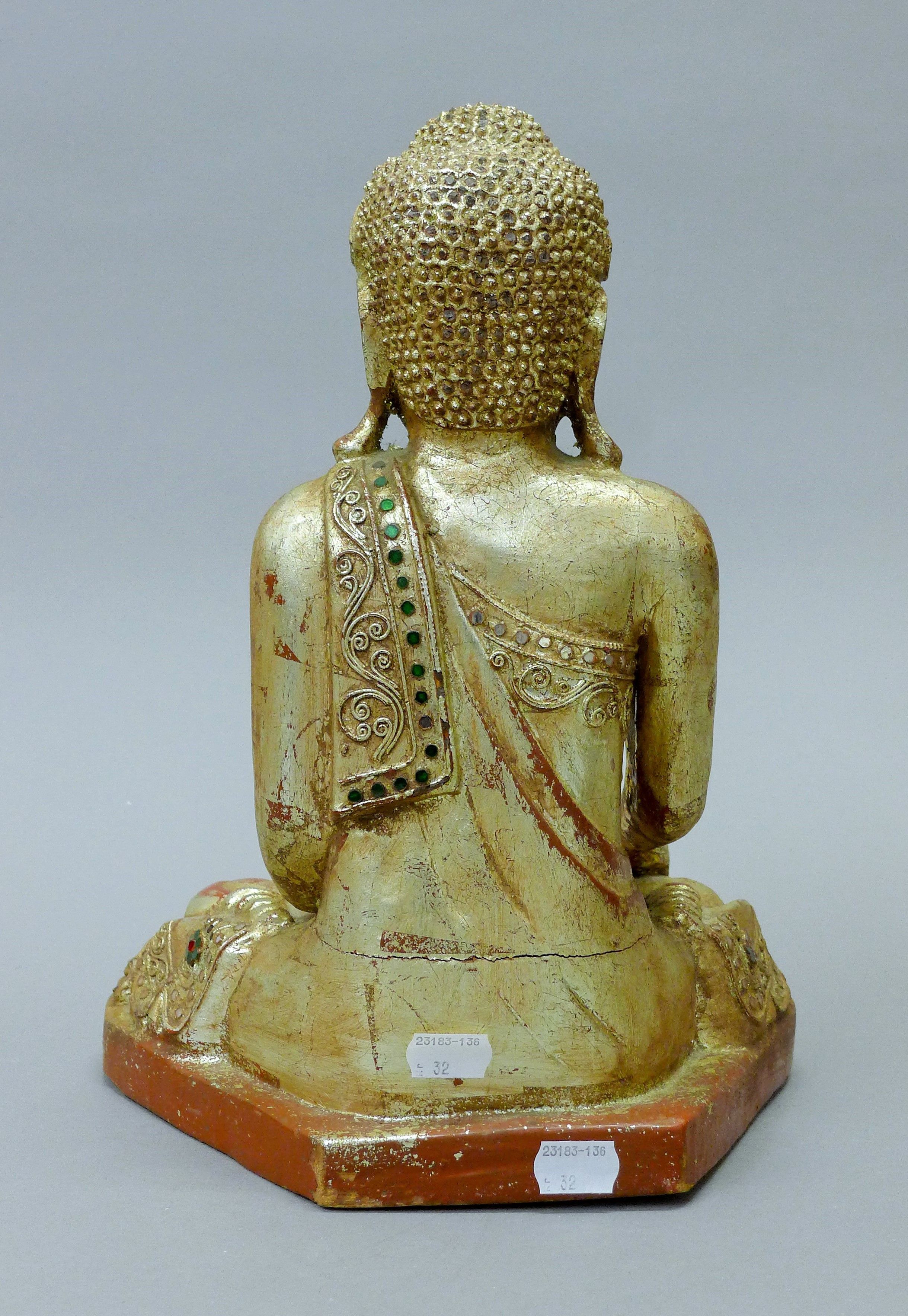 A gilt wood model of Buddha. 33 cm high. - Image 4 of 4