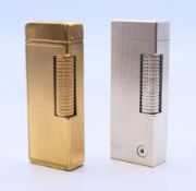 Two vintage Dunhill lighters, each with leather case. Each 6.5 cm high.