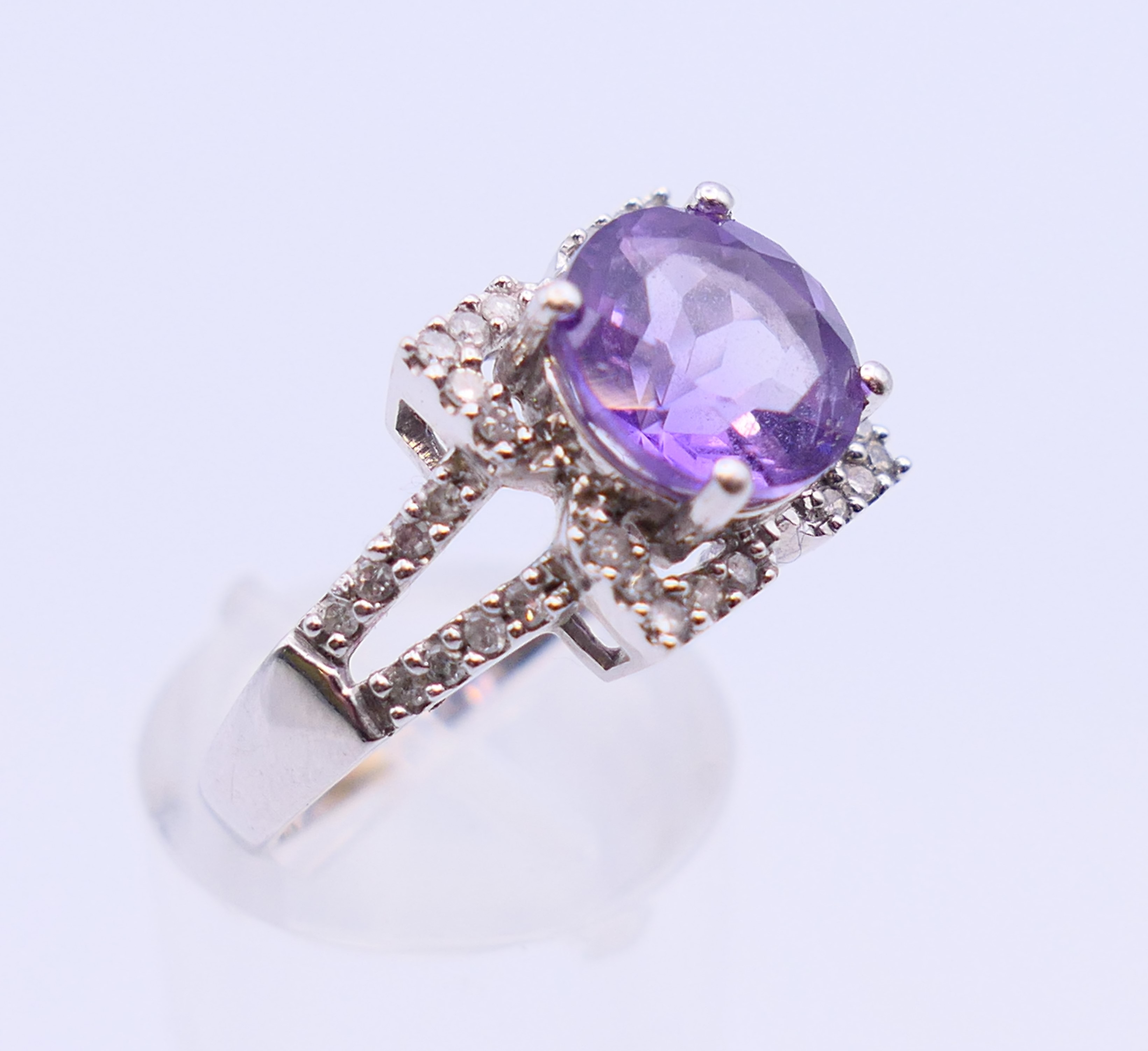 A 9 ct white gold, amethyst and diamond ring. 4.4 grammes. Ring size Q/R. - Image 2 of 5