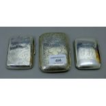 Three silver cigarette cases. The largest 10 cm long. 235.2 grammes total weight.