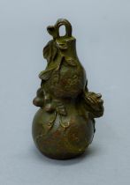 A bronze model of a double gourd. 7 cm high.