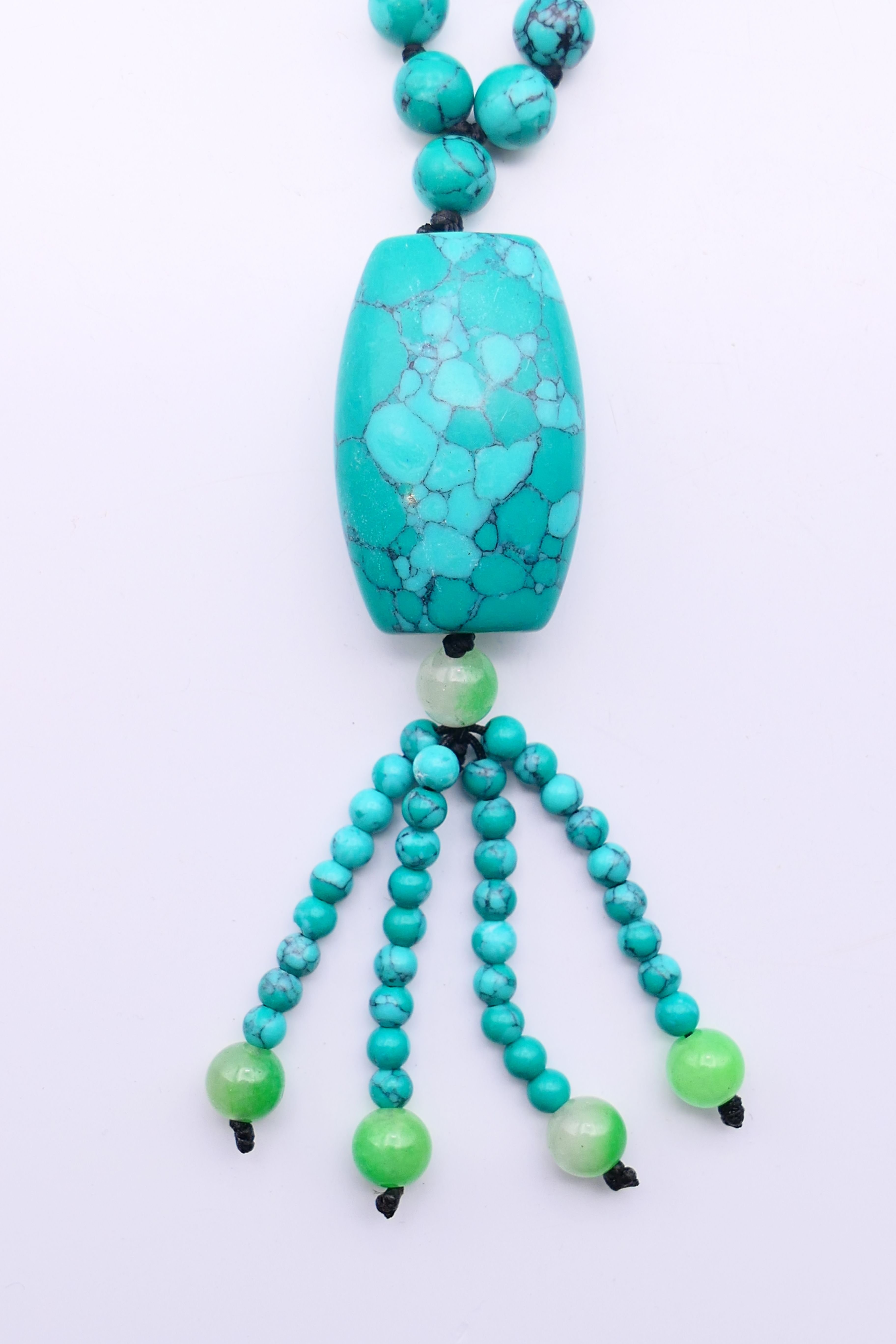 A string of turquoise beads with a turquoise pendant. - Image 2 of 3