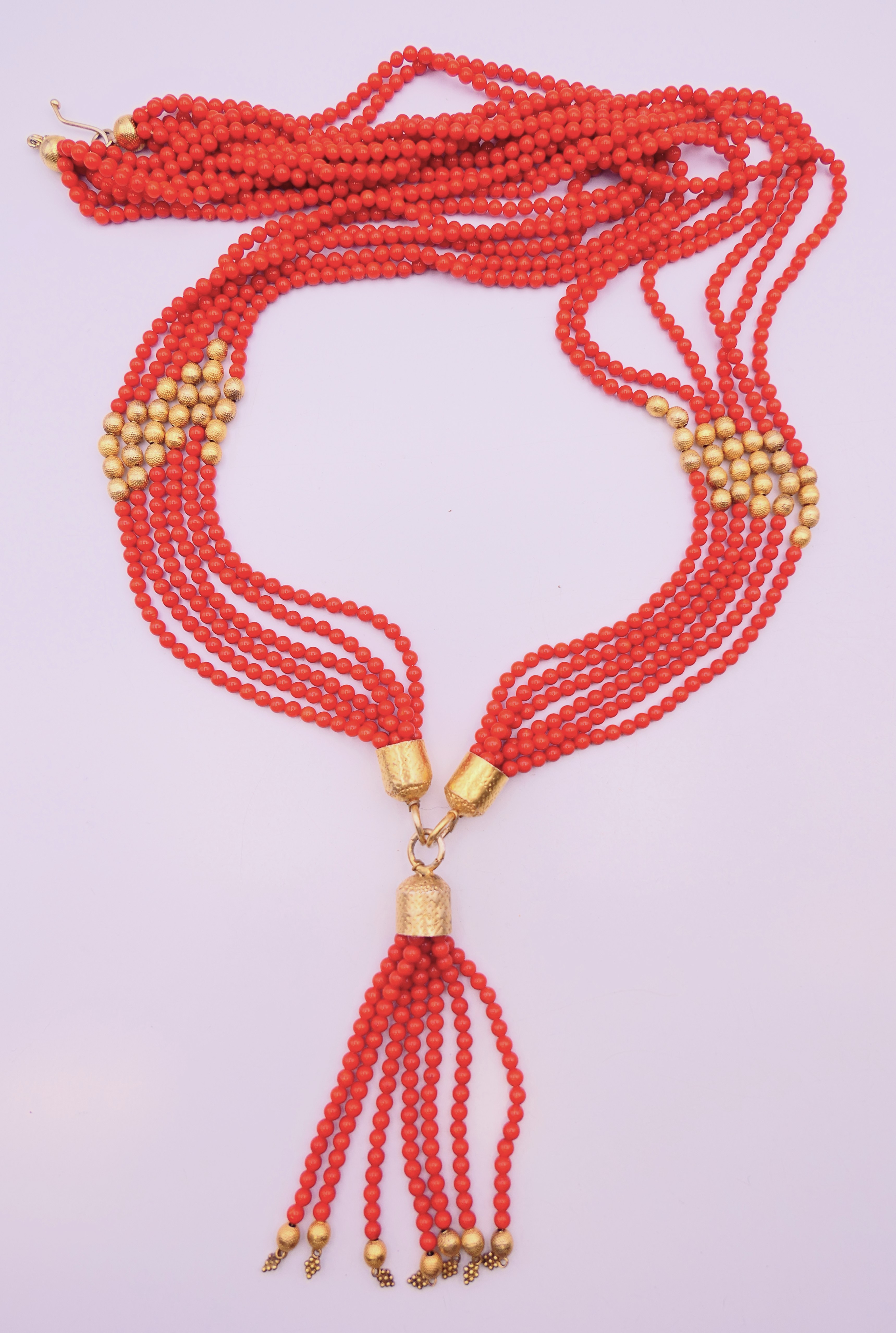 A vintage six-strand bead necklace with silver gilt beads and mounts.