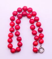 A string of coral beads. 45 cm long.