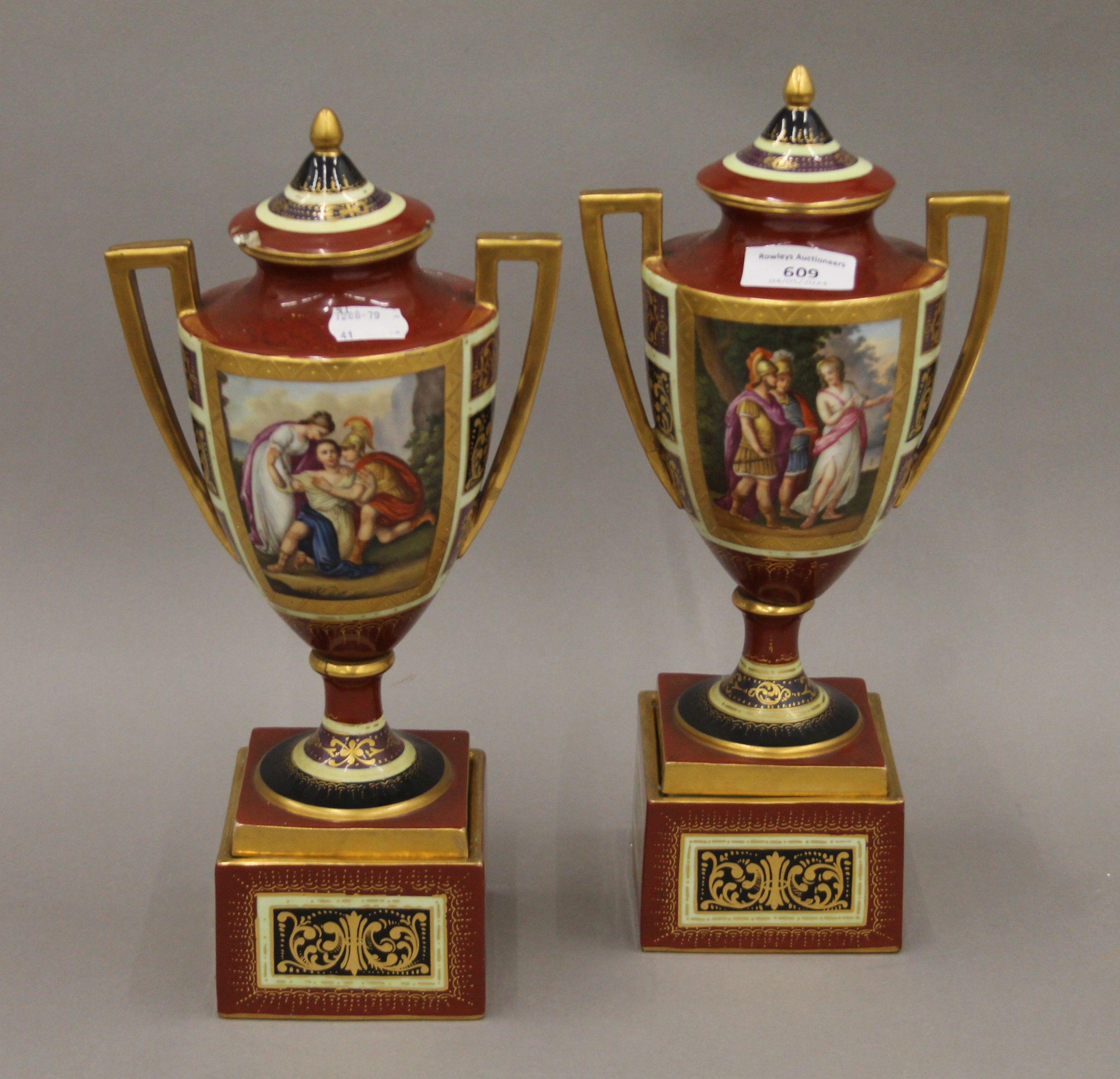 A pair of Vienna porcelain lidded vases on stands. 32 cm high.