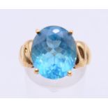 A 9 ct gold Swiss blue topaz ring with certificate of authenticity stating 8.640 ct, 5.