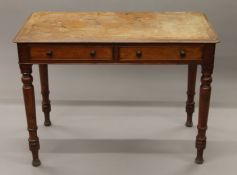 A 19th century mahogany two-drawer side table. 103 cm wide.