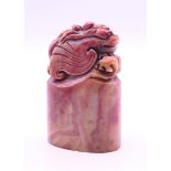 A Chinese hardstone seal. 8 cm high.