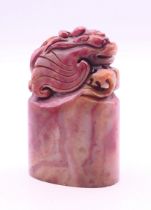 A Chinese hardstone seal. 8 cm high.