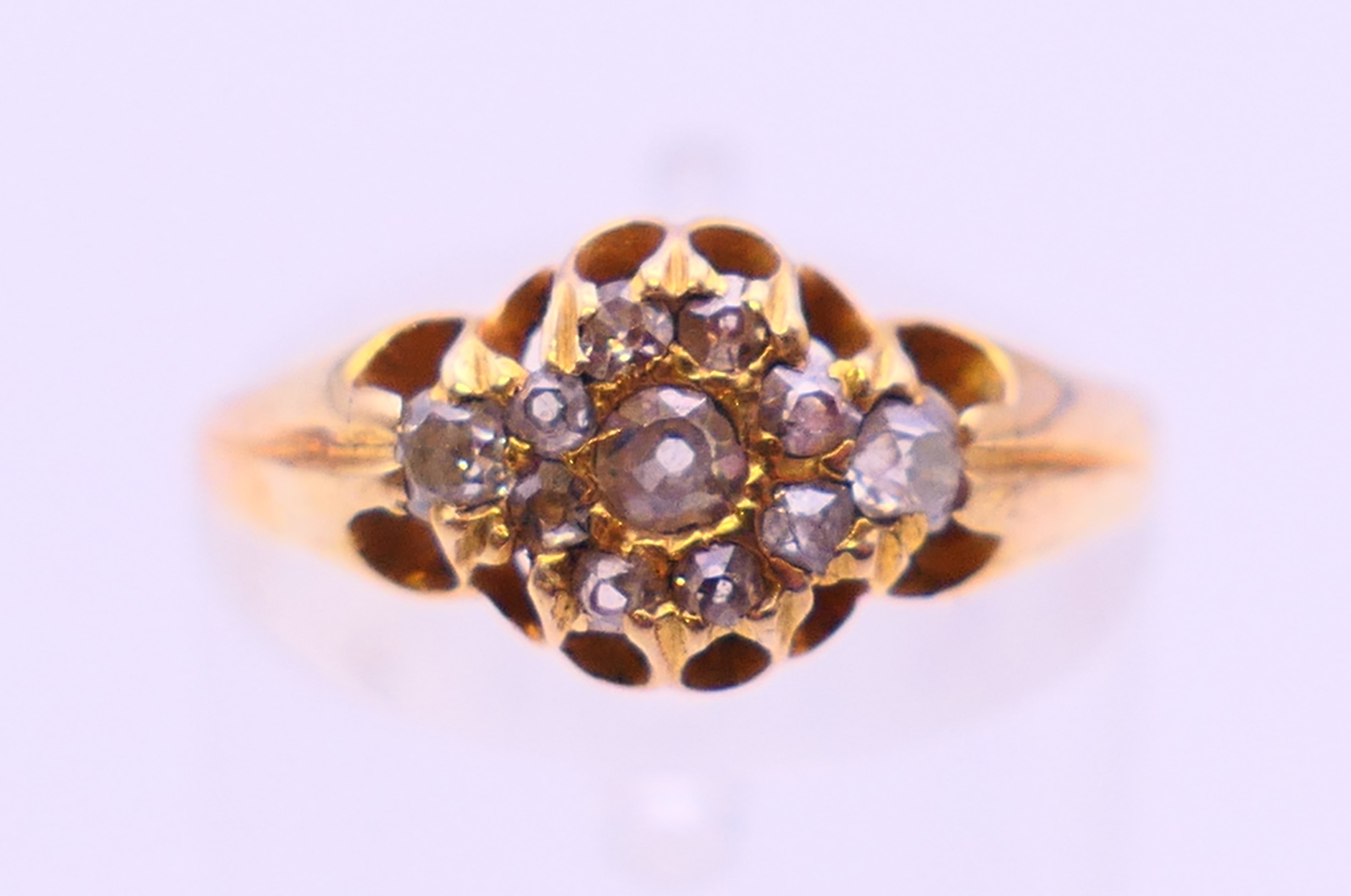 An 15 ct gold diamond set ring. Ring size O.