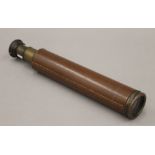 A leather-bound brass three-draw telescope, stamped Rangers Enbeeco, London. 69 cm long extended.