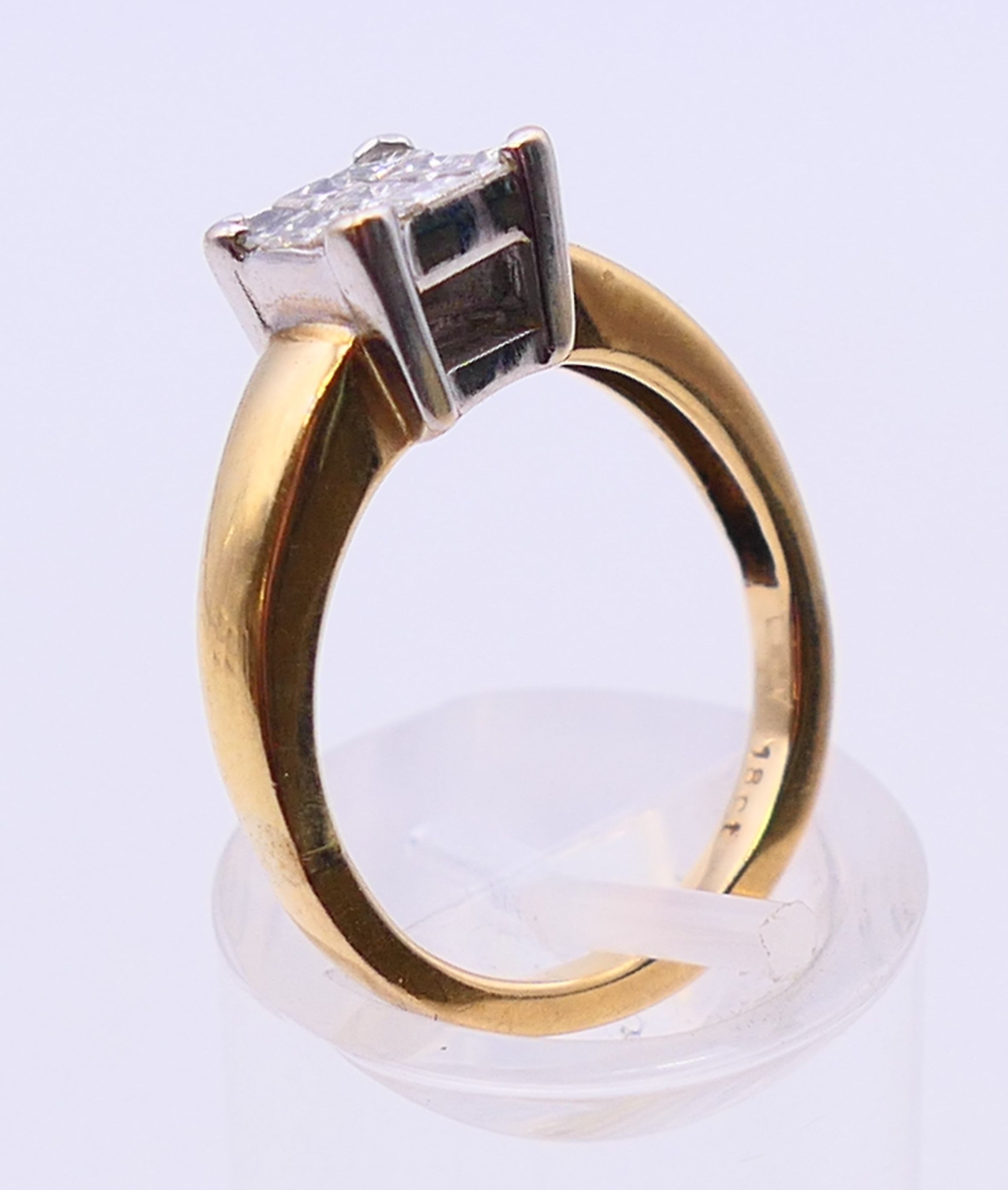 An 18 ct gold ring set with nine diamonds. together with a copy of a 2012 insurance valuation. - Image 5 of 8