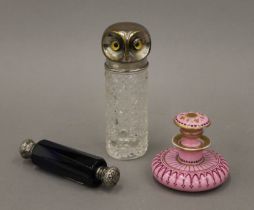 Three perfume bottles, one with silver-plated lid modelled as an owl. 11.5 cm high.