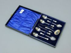 A cased set of silver spoons, tongs and sifter, hallmarked for Birmingham 1916, boxed. The box 18.