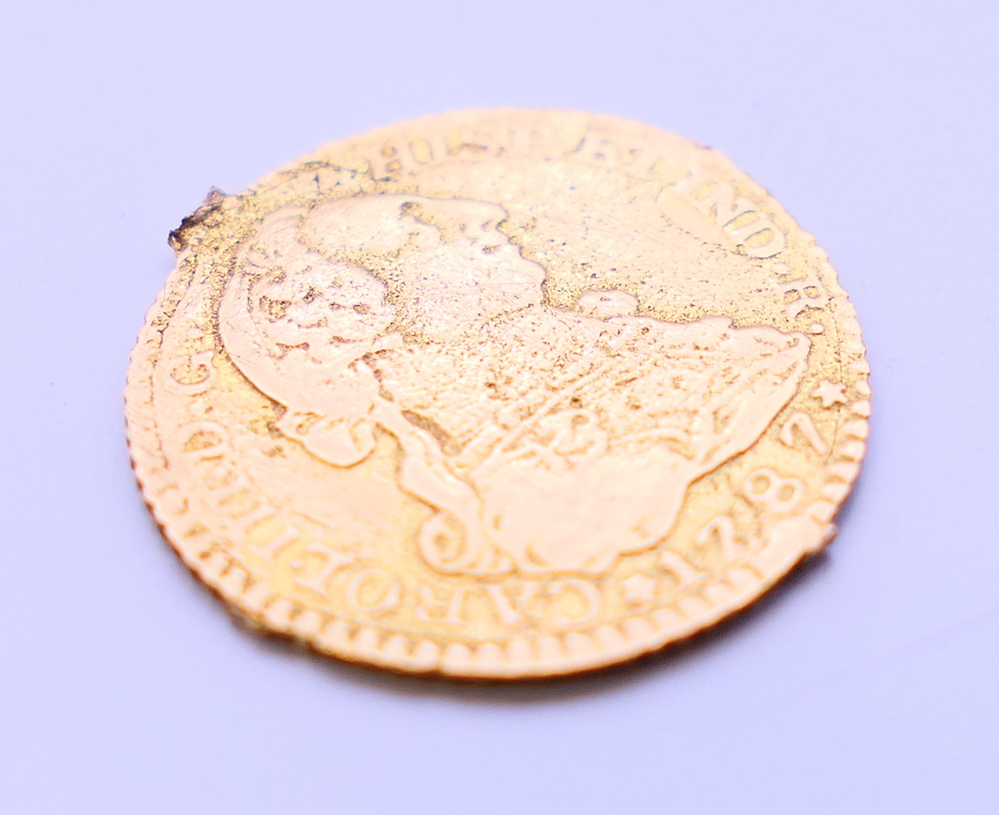 A 1787 gold Escudo coin. 1.75 cm diameter. 2.1 grammes. - Image 4 of 4