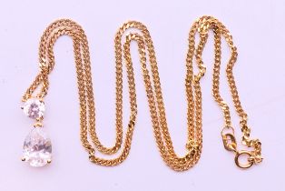 A 14 ct gold chain and pendant. Pendant 1.5 cm high, chain 44 cm long. 5.8 grammes total weight.