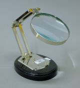A magnifying glass on a stand. 30 cm high.
