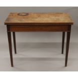 A 19th century mahogany fold-over tea table. 93.5 cm wide.